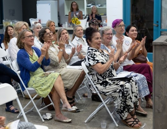 Women applauding at an event
