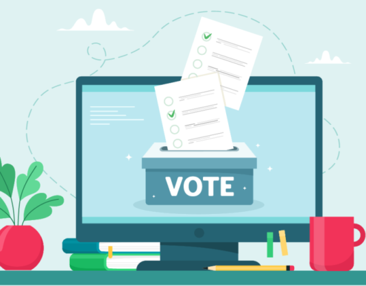 computer with a voting box and ballots