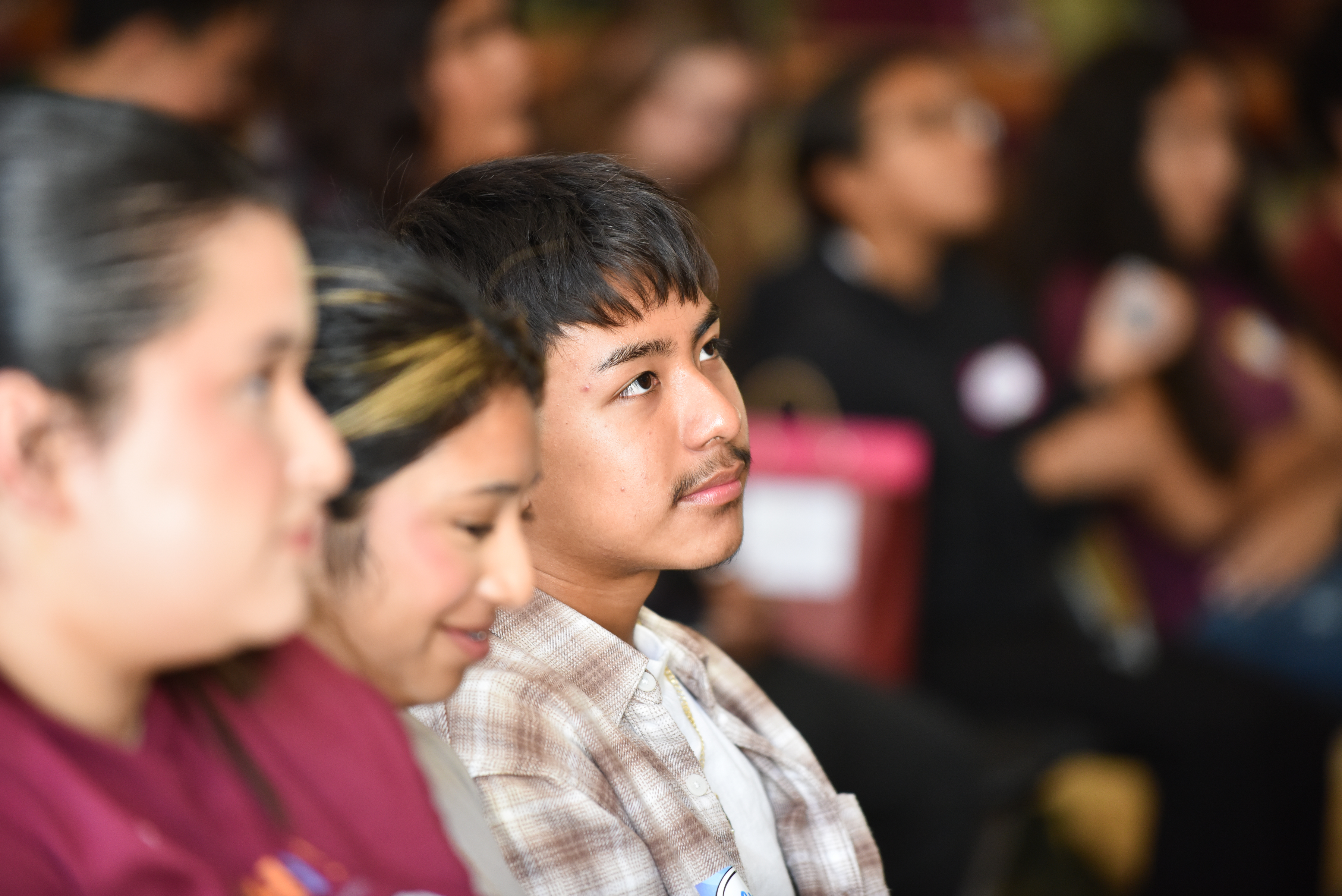 Students listening to program