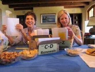 Volunteers gather for a member mailing