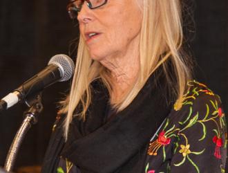 Research Co-Chair, Mary Rogers at the mic