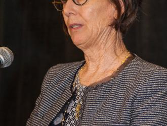 Steering Co-Chair, Nancy Harter, closes the presentation by announcing our 10-for-10 Challenge