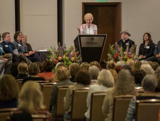 Sandy Schoolfield congratulates the grantees