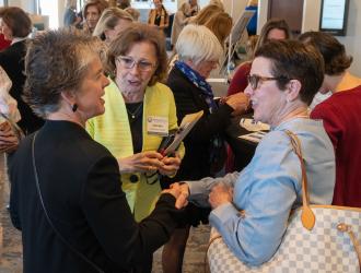 Volunteer Liaison greeting members