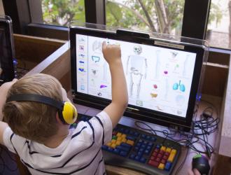 Friends of the Santa Barbara Public Library: little boy at the computer (photo: Natalie Thomson, Photography)