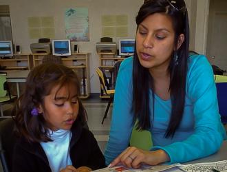 People's Self-Help Housing: tutor working with young student