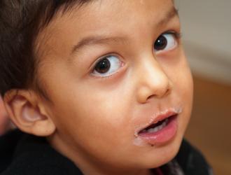 Storyteller Children's Center: little boy with milk "mustache"