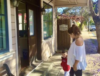Woman and her child approach Legal Aid office