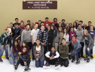 Academy for Success class enjoying a round of ice hockey