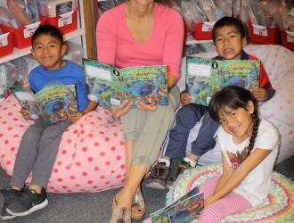 Dyslexia Intervention Program - Teacher reading with 3 students