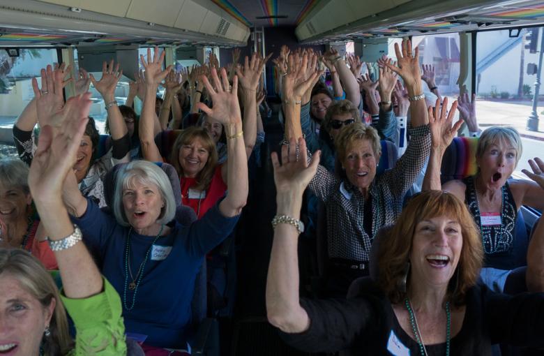Women's Fund members and guests tour grantee sites on four SB Airbuses