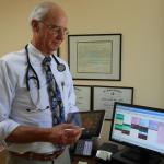 Santa Barbara Neighborhood Clinics: doctor with electronic files on computer