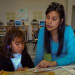 People's Self-Help Housing: tutor working with young student