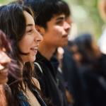 Students listing to program