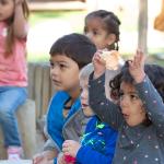 Smiling children participating in learning activity